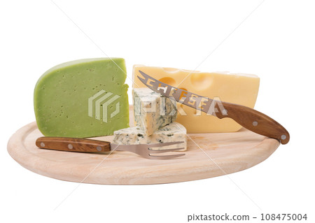 A set of different cheeses on a wooden platter. A set of different cheeses on a wooden platter. 108475004