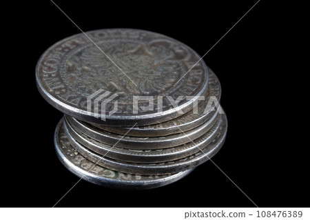 Stack of old vintage silver medieval taller coins 108476389