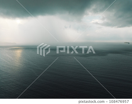 Aerial view of storm clouds with ocean landscape in the morning Aerial view of storm clouds with ocean landscape in the morning 108476957