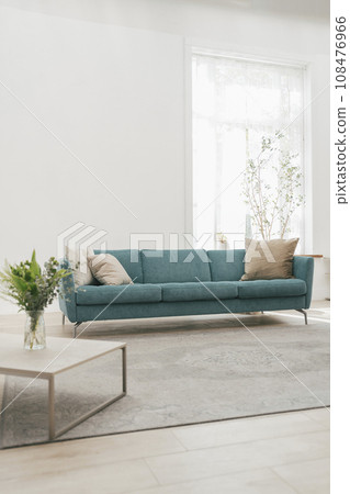 Living room with blue sofa Living room with blue sofa 108476966