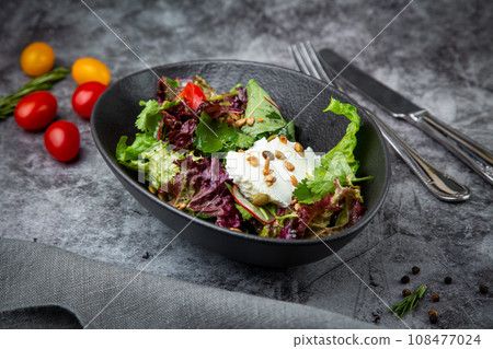 salad with spinach, eel, lime, sour cream, side view salad with spinach, eel, lime, sour cream, side view 108477024