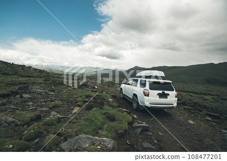 Off road car on top of high altitude mountain trail, China Off road car on top of high altitude mountain trail, China 108477201