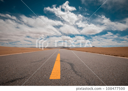 Trail in desert under blue sky Trail in desert under blue sky 108477500