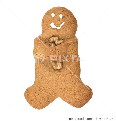 Gingerbread man cookie embrancing walnut Gingerbread man cookie embrancing walnut 108478092