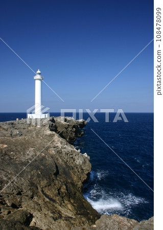 lighthouse jutting out into the sea 108478099