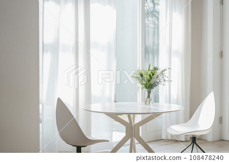 Dining table with vases, windowsill, living with flowers, image 108478240