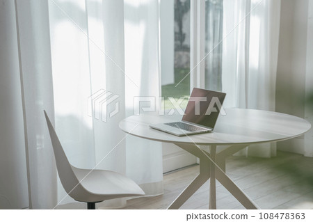 Table with laptop computer remote work image 108478363