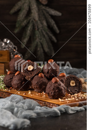 Dark chocolate truffles with hazelnuts Dark chocolate truffles with hazelnuts 108478899