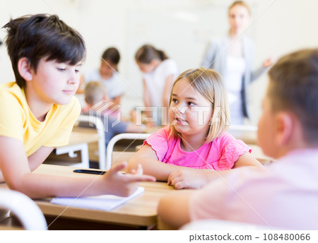 Children performing group tasks 108480066