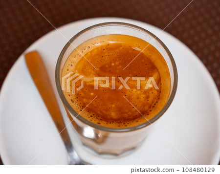 Mug of cortado served on table in cafe Mug of cortado served on table in cafe 108480129