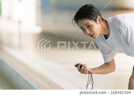 swimming coach and stopwatch swimming coach and stopwatch 108481504