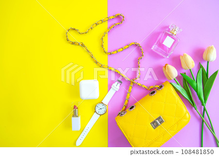 Fashion stylish yellow bag and woman accessories pastel background Fashion stylish yellow bag and woman accessories pastel background 108481850