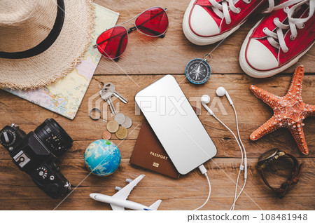 Travel accessories costumes. The cost of travel maps prepared for the trip.travel planning concept 108481948