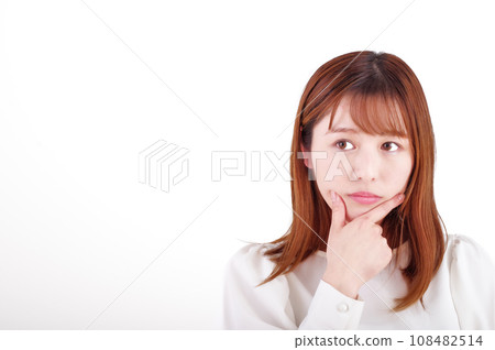 A young woman thinking (white background) A young woman thinking (white background) 108482514