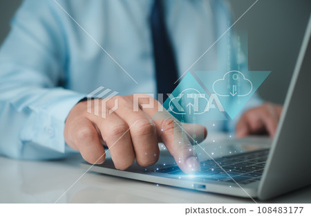 Businessman downloading business data from internet network showing usage of big data network and cloud computing system. 108483177