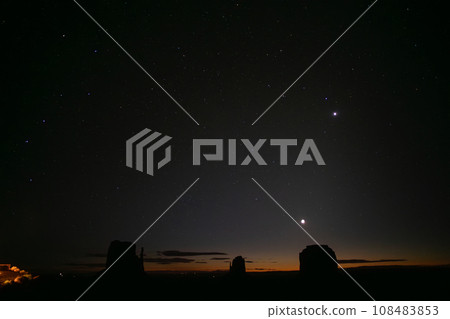 Night sky and Monument Valley where the Big Dipper shines 108483853