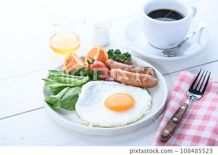 Breakfast of fried egg, salad and coffee Breakfast image 108485523