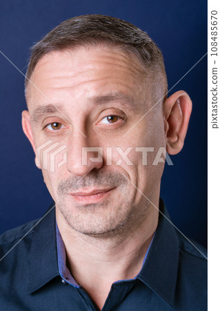 portrait of a man in a dark blue shirt portrait of a man in a dark blue shirt 108485670