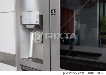 Water button in front of refrigerator Water button in front of refrigerator 108487836