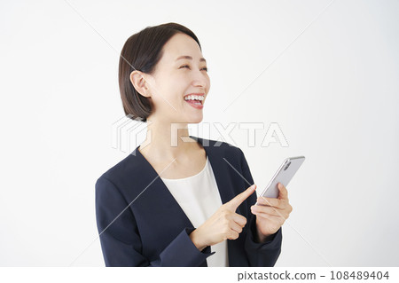 Middle-aged business woman using a smartphone, white background Middle-aged business woman using a smartphone, white background 108489404