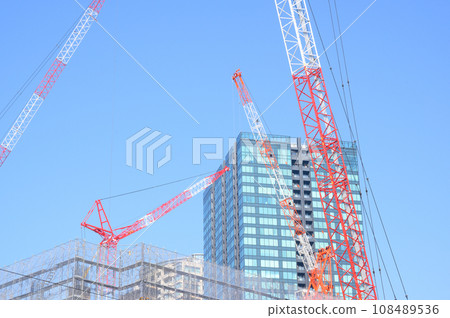 A view of a large crane at a construction site in Tokyo A view of a large crane at a construction site in Tokyo 108489536