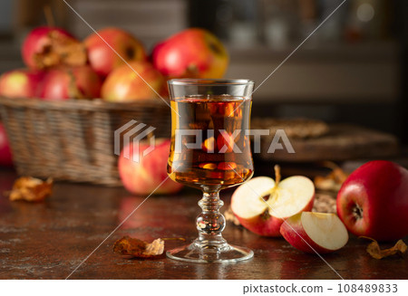 Apple juice on an old kitchen table. 108489833