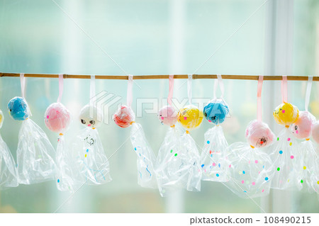 Nursery teacher making teruteru bozu at nursery school 108490215