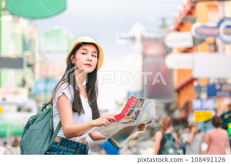 Traveler woman with map in bangkok city Traveler woman with map in bangkok city 108491126