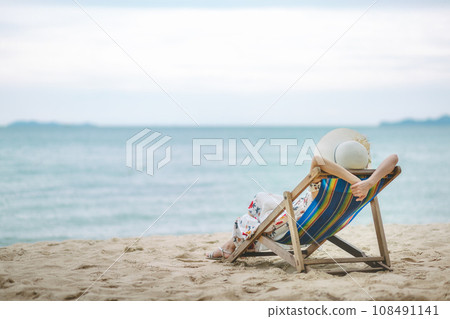 Woman on beach in summer 108491141