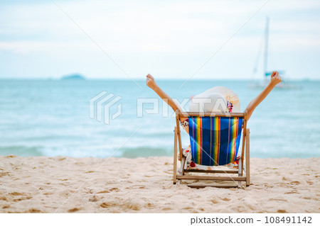 Woman on beach in summer 108491142