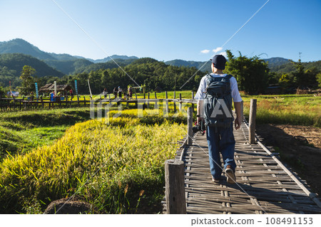 Traveler man with camera 108491153