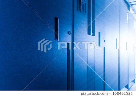 row of server cabinets inside data center room 108491525