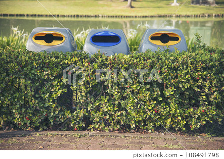 Trash cans for sorting garbage recycle bin waste plastic container collection. Reuse, reduce, recycle sorting process sustainable lifestyle rubbish dustbin plastic box in green garden. Trash cans for sorting garbage recycle bin waste plastic container collection. Reuse, reduce, recycle sorting process sustainable lifestyle rubbish dustbin plastic box in green garden. 108491798