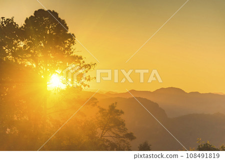 Scenic view dramatic beautiful sunset sky. Natural Sunset Sunrise on meadow silhouette shadow dark land. Vibrant dramatic sky on sunset, dawn, sunrise in Countryside. Landscape Colorful Sky At Sunset Scenic view dramatic beautiful sunset sky. Natural Sunset Sunrise on meadow silhouette shadow dark land. Vibrant dramatic sky on sunset, dawn, sunrise in Countryside. Landscape Colorful Sky At Sunset 108491819