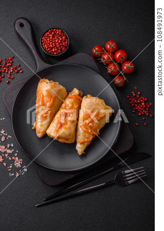 Delicious cabbage rolls with meat, rice, salt, spices and herbs Delicious cabbage rolls with meat, rice, salt, spices and herbs 108491973