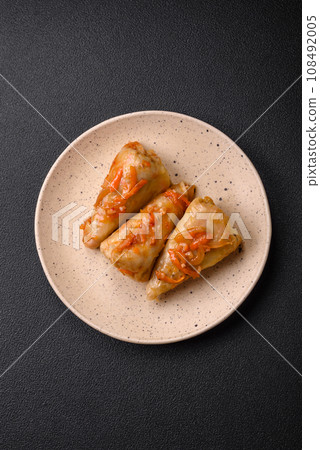 Delicious cabbage rolls with meat, rice, salt, spices and herbs 108492005