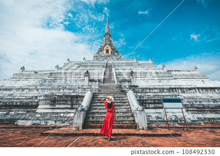Traveler woman travel in Wat Phu Khao Thong pagoda temple at Ayutthaya historical park Thailand Traveler woman travel in Wat Phu Khao Thong pagoda temple at Ayutthaya historical park Thailand 108492330