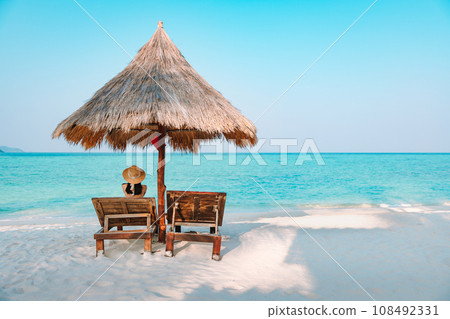 Happy traveler asian woman travel and relax on chair beach in summer Thailand Happy traveler asian woman travel and relax on chair beach in summer Thailand 108492331