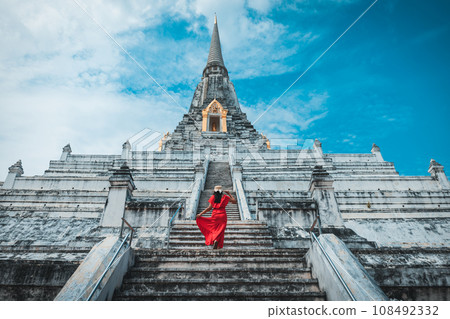 Traveler woman travel in Wat Phu Khao Thong pagoda temple at Ayutthaya historical park Thailand 108492332