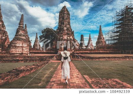 Traveler woman travel in Wat Chaiwatthanaram temple at Ayutthaya historical park Thailand Traveler woman travel in Wat Chaiwatthanaram temple at Ayutthaya historical park Thailand 108492339