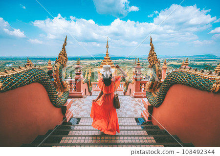 Traveler asian woman with dress travel in temple at Lampang Thailand 108492344
