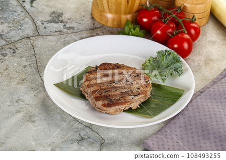 Grilled tuna medallion in the plate Grilled tuna medallion in the plate 108493255