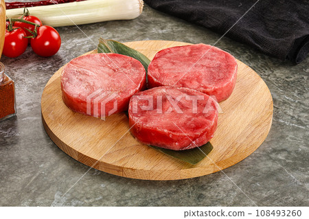 Delicous raw tuna medallion for cooking 108493260