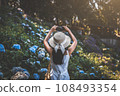 Traveler woman with mobile phone travel in flower garden at Chiang Mai Thailand 108493354