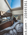 Travel woman with mobile phone relax inside a camper car recreational vehicle 108493361
