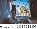 Travel woman relax inside a luxury camping dome tent 108493366