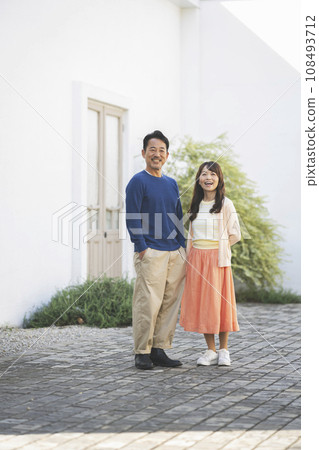 Portrait of a couple in their 50s smiling at the camera Portrait of a couple in their 50s smiling at the camera 108493712