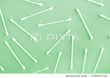 Pattern of white plastic cotton swabs or sticks top view 108493742