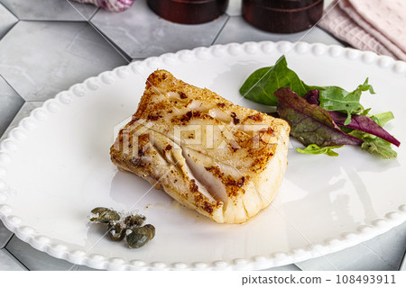 Roasted cod fish steak with salad Roasted cod fish steak with salad 108493911