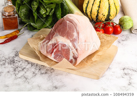 Uncooked raw pork knuckle with spices 108494359